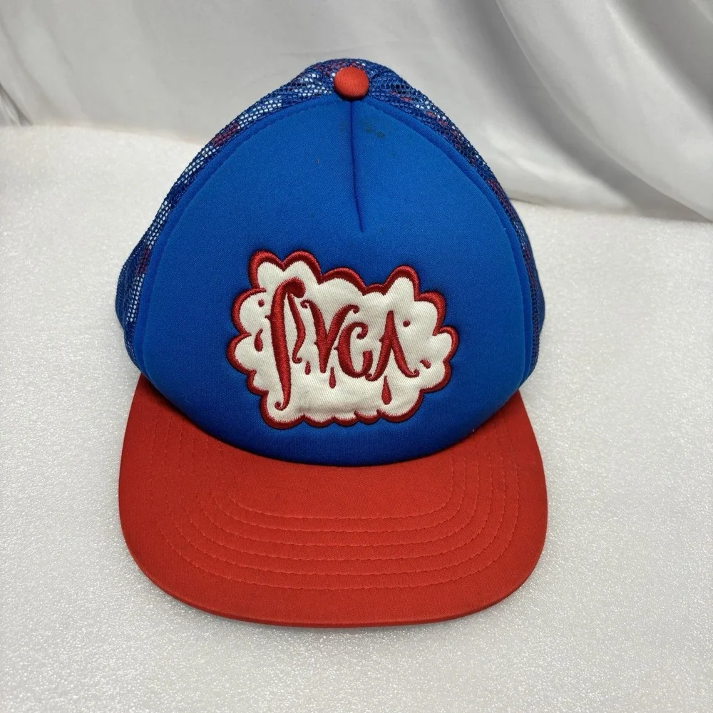 RVCA foam trucker hat featuring a blue crown, red brim, and red mesh back